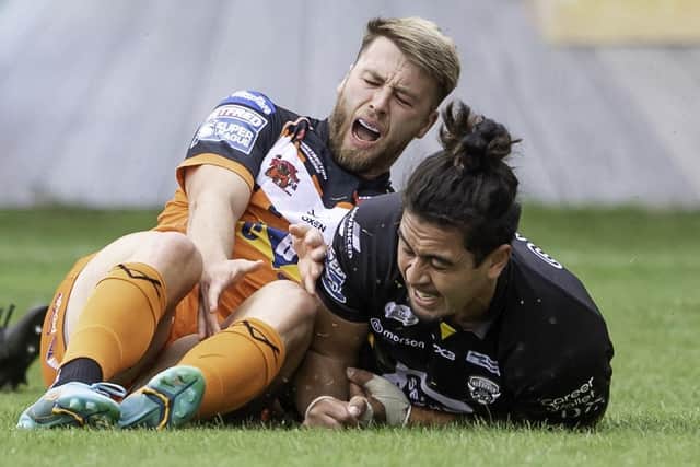 Castleford's Danny Richardson reacts to his knee injury against Salford. Picture: Allan McKenzie/SWpix.com