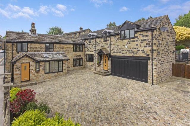 The detached property with its attractive cobbled forecourt.