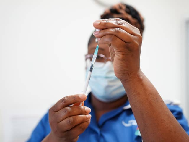 A nurse prepares a dose of a coronavirus vaccine. (Photo by Jacob King - WPA Pool / Getty Images)