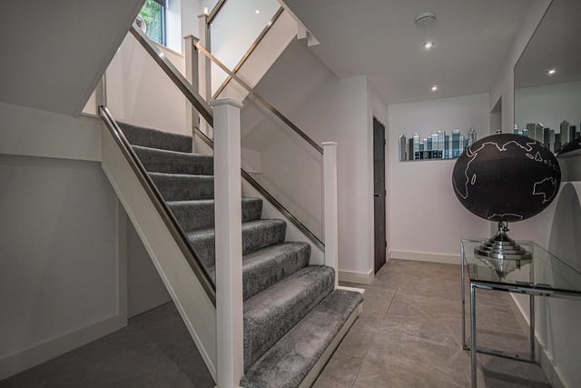 The entrance hall to the property is fitted with a contemporary 1/2 turn staircase that rises to the first floor.