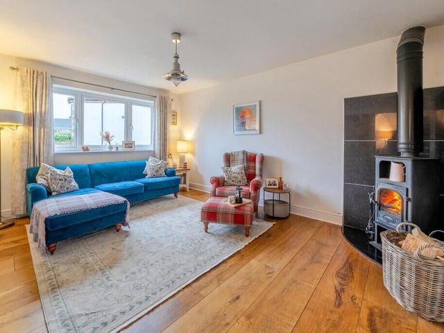 The cosy lounge with feature log burner.