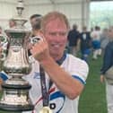 Dave Wandless with the World Nations Cup after playing in the over 60s walking football final when England beat France 3-0.