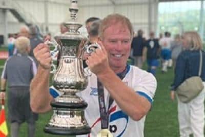 Dave Wandless with the World Nations Cup after playing in the over 60s walking football final when England beat France 3-0.