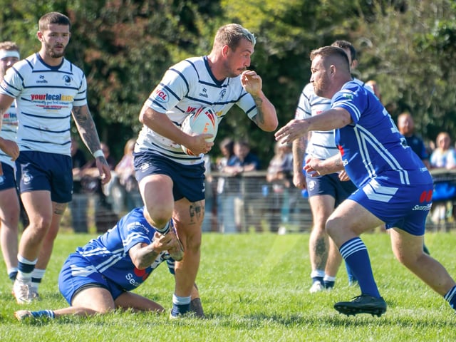 Man of the match Josh Hardcastle takes up a Lions forward drive.