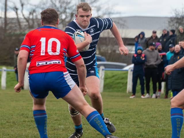 Featherstone Lions' Harvey Farrar makes a surge at the Great Britain Police line.