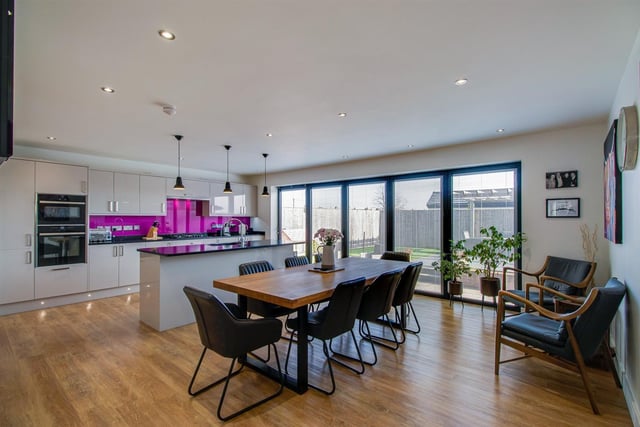 The open plan kitchen and diner with bi-folding doors out to the patio and garden.