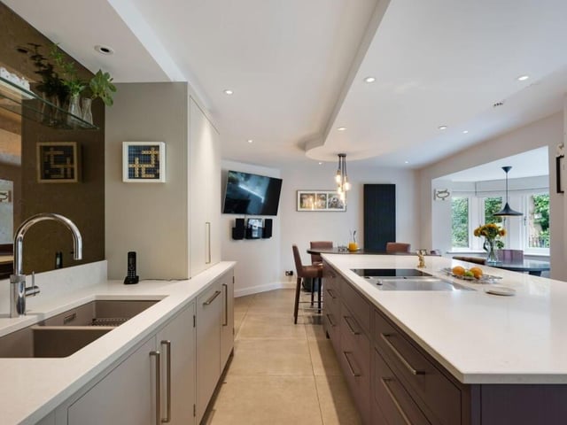 The high spec kitchen has a breakfast bar and a dining bay.