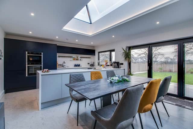 The living kitchen has a lantern style roof adding to the natural light, and bi-fold doors to outside.