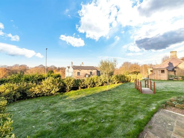 View across the lawned garden to the rear of the property.