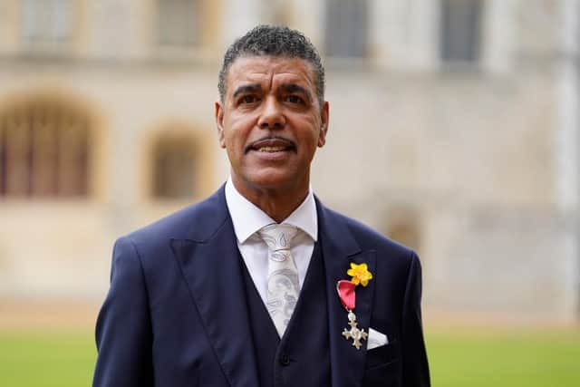 Footballer turned pundit and TV presenter Chris Kamara has made the appearance of a lifetime at Windsor Castle where he has received his MBE from the Prince of Wales. (Getty)