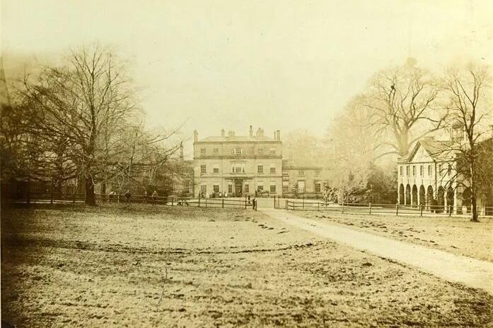 Old picture of Newland Hall with stable block to right.
