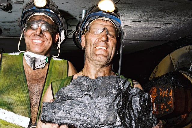 Pitt captures workers at Kellingley Colliery smiling at the camera