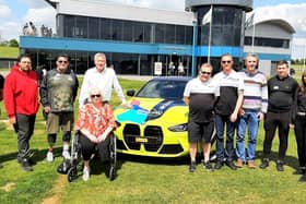 A group of attendees at a previous Chequered Flag Motorsport event at Thruxton Race Circuit in Hampshire.