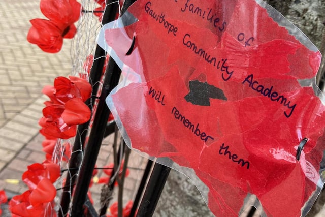 Community displays filled Ossett Market Place with red, yellow and white poppies.