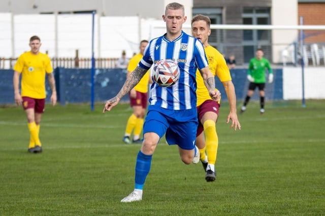 Frickley Athletic skipper Richard Collier controls the ball.