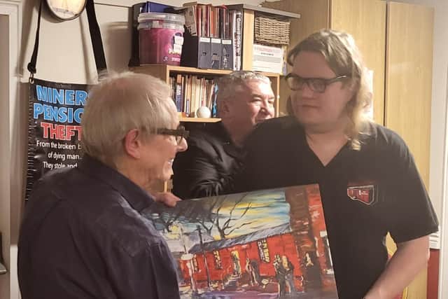 Ken Loach was presented with a canvas of a Tim Burton painting of The Red Shed as a thank you by the Wakefield club.