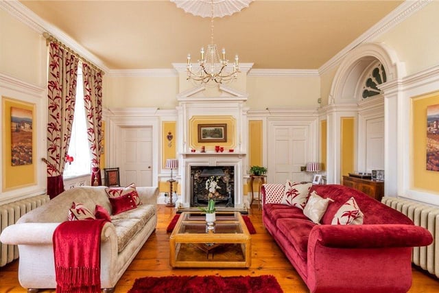 The drawing room is bright and spacious, with period decorative detail.