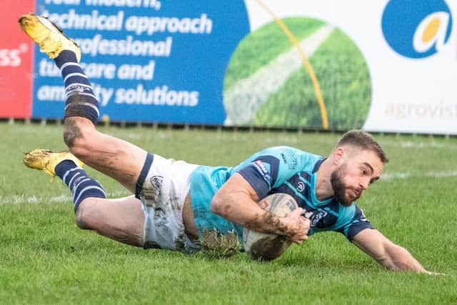 Connor Jones dives over for a try for Featherstone Rovers against Dewsbury Rams. Picture: JLH Photography