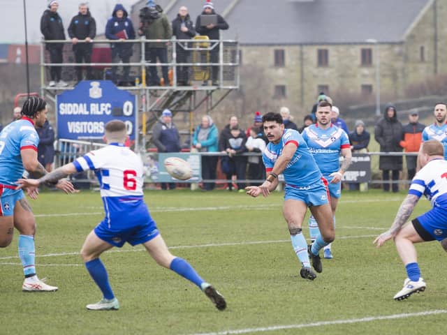 Mathieu Cozza passes the ball on as Wakefield Trinity go on the attack in their 70-6 Challenge Cup win at Siddal. Picture: Jim Fitton