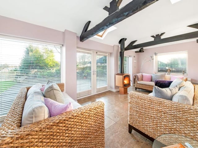 The garden room, with stylish wood burning stove.