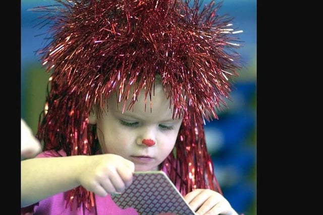 Big Hair day at Holy Trinity day nursery in aid of Comic Relief. Ellie Stockhill gets to grips with a jigsaw.