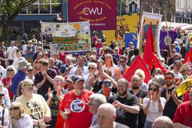 Banners representing the collieries of the Wakefield districts and trade unions from around the country marching through Wakefield on the 40th anniversary of the miners’ strike. Photo: Scott Merrylees
