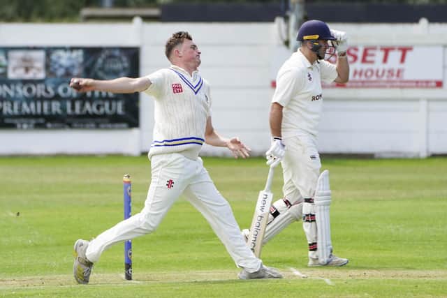 James Wade delivers on his way to taking two wickets for Ossett against Woodlands. (Photo by Scott Merrylees)