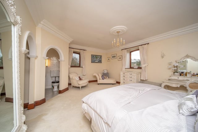 A majestic main bedroom with en suite facility, and a dressing room.