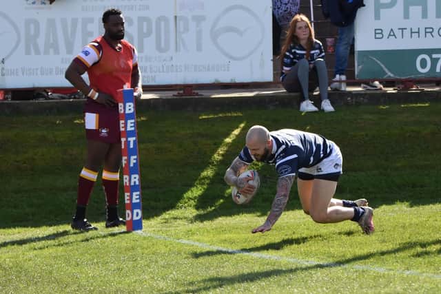 Luke Briscoe about to go over for a try for Featherstone Rovers at Batley. Picture: Rob Hare