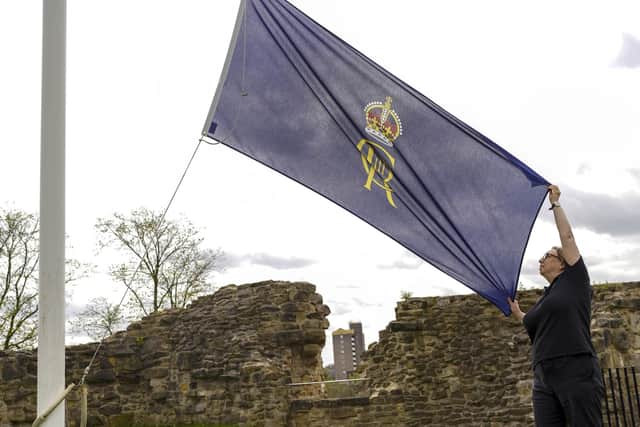 Visitor Services Assistant Tina Wittorf with the Royal Cipher flag at Pontefract Castle ahead of the 'Right Royal Day Out'. Picture Scott Merrylees