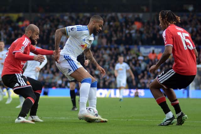 Lukas Nmecha holds the ball up for Leeds United against Manchester United.
