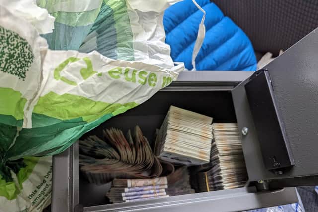 An estimated £500,000 worth of drugs and a substantial amount of cash was seized.