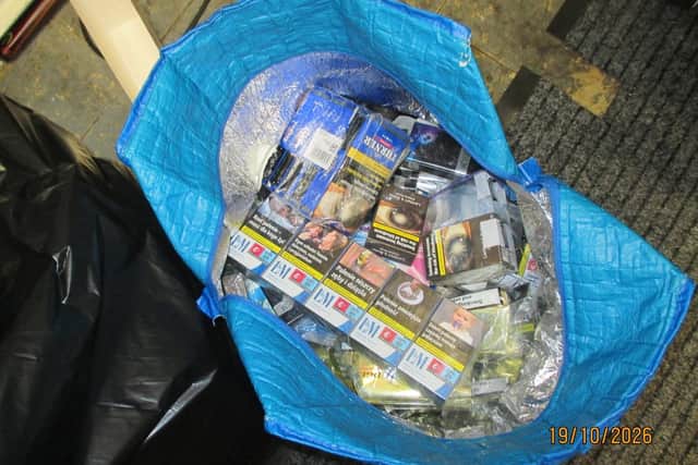 Two cars  and illegal cigarettes were seized after raids on two shops in Pontefract area