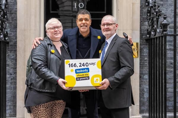 Marie Curie Ambassador Chris Kamara joined them in handing over the Dying in Poverty petition to 10 Downing Street.