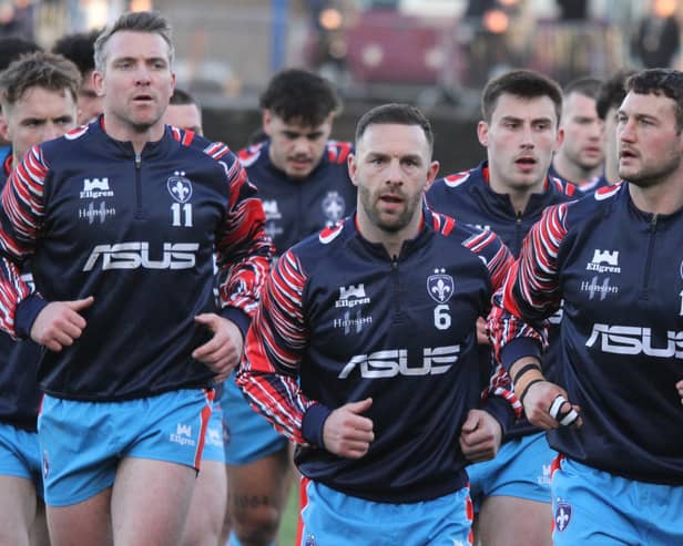 Wakefield Trinity players have a determined look before going on to beat Featherstone Rovers. Picture: Kevin Creighton