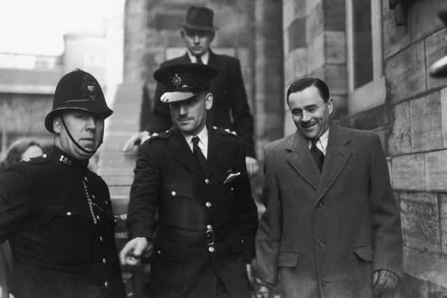 John George Haigh leaves Horsham Magistrate's Court after an adjournment in his trial for the murder of wealthy widow Olivia Durand-Deacon, 1st April 1949. Haigh is accused of shooting Mrs Durand-Deacon and dissolving her corpse in acid, hence his subsequent nickname of 'The Acid Bath Murderer'. He was found guilty of the murder and several others, and executed. (Photo by Douglas Miller & J. Wilds/Keystone/Hulton Archive/Getty Images)