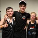 Young boxers Connor Marshall (left) and Harry Milnes with Max Clark and his father Paul.
