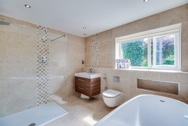 The house bathroom features a stand alone bath with mixer tap and shower attachment, a separate shower cubicle with an overhead shower and a glass shower screen. The bathroom is also fully tiled and with underfloor heating.