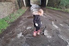 Little Willow loves a puddle, but mum Donna said these were really deep at the weekend - on Chevet Terrace in Walton.