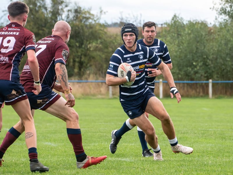 Kian Fisher leads a Lions' attack.
