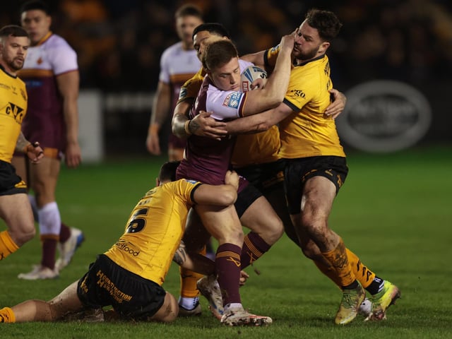 Daejarn Asi and Joe Stimson are on hand to stop Sam Halsall.