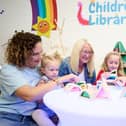 Lynsey Clark, Secretary of the  Friends of Airedale Library with her niece  Everlyn Clark, Coun Lynn Masterman and children from Townville Infants School.