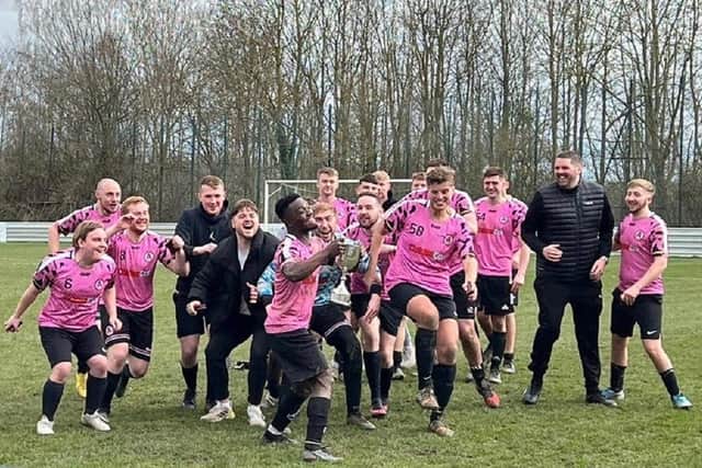 Captain Waisu Adeniran leads the celebrations after Alverthorpe Athletic's cup final success over Wakefield Athletic B.