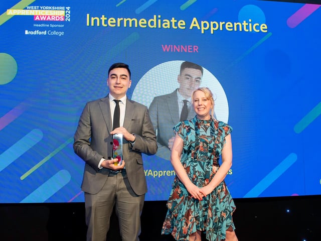 Award winner Alin Florin Pop, of Unity Plus Healthcare Ltd, with Laura Collins