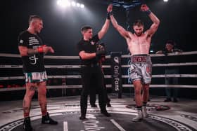 Nathan Owens has his hand raised after winning his first bareknuckle boxing fight against David Round.