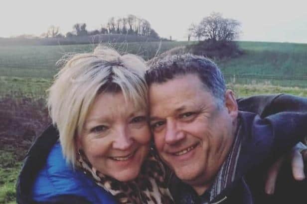 Michael Holmes died at the scene and his widow Teresa was airlifted to hospital after they crossed a field on a public right of way with their two dogs.