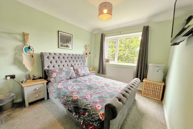 One of the double rooms with fitted sliding wardrobes, and views of the garden.