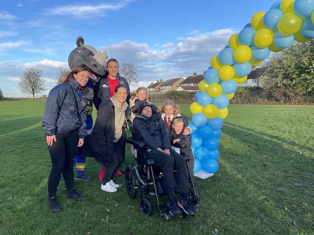 Rob Burrow and family (pictured here at a school running event) will take part in a "Lap of honour" at the Leeds 10K Marathon