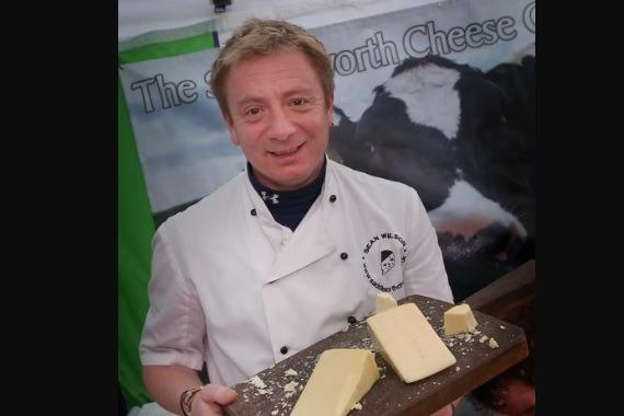 Sean Wilson, aka Corrie's Martin Platt, with his cheese at the festival in 2011.