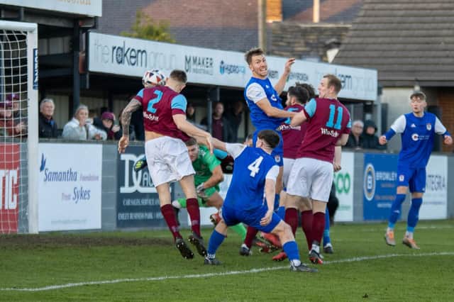 Sam Pashley heads home Emley's goal against Squires Gate in the FA Vase. Picture: Mark Parsons